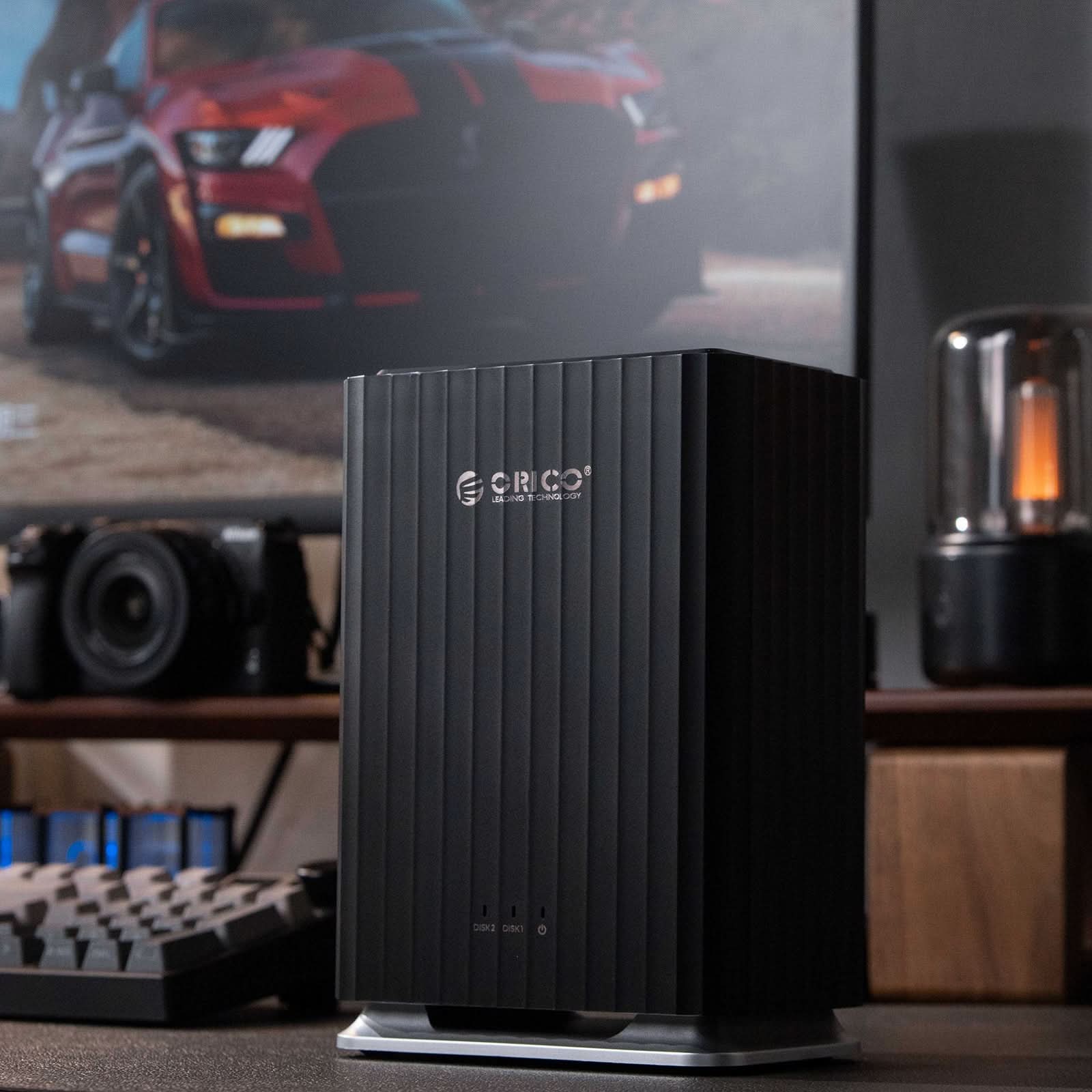 ORICO 5-bay desktop hard drive enclosure on desk setup with keyboard and monitor, aluminum vertical storage dock for HDD and SSD expansion